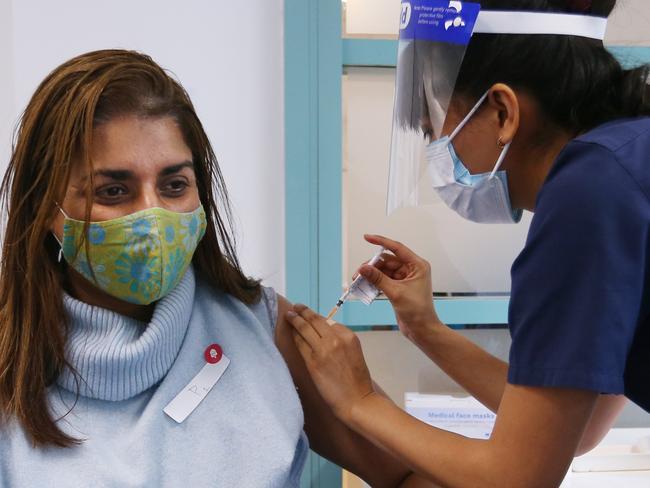 SYDNEY, AUSTRALIA - JULY 01: A nurse administers the Pfizer vaccine to a client at the St Vincent's Covid-19 Vaccination Clinic on July 01, 2021 in Sydney, Australia. Much of Australia is in lockdown or subject to some form of restriction as community cases of the COVID-19 Delta variant continue to be recorded around Australia. Currently, the Pfizer vaccine is available to frontline workers, people with pre-existing health conditions and people in their 40s and 50s, while the AstraZeneca vaccine is recommended for people over 60. Prime Minister Scott Morrison on Monday announced an indemnity scheme for general practitioners, saying anyone could receive AstraZeneca at a GP clinic despite vaccine advisory group ATAGI recommending Pfizer as the preferred vaccine for those under 60. (Photo by Lisa Maree Williams/Getty Images)