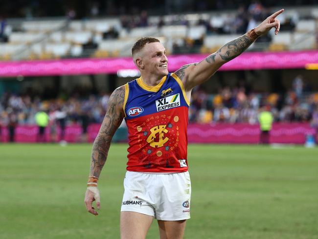 Mitch Robinson celebrates after a Brisbane win in 2021. (Photo by Jono Searle/AFL Photos/via Getty Images)