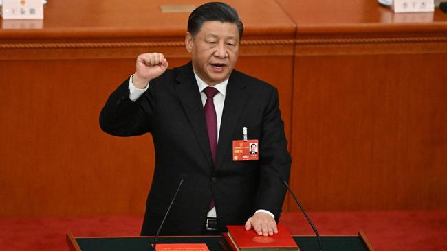 Xi Jinping swears the oath of office after being re-elected for a third term in Beijing’s Great Hall of the People on Friday. Picture: AFP