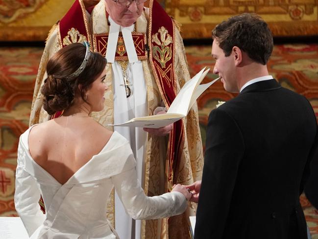 The bride wanted a low backline for her gown to show her scar from surgery to correct curvature of the spine. Picture: Getty