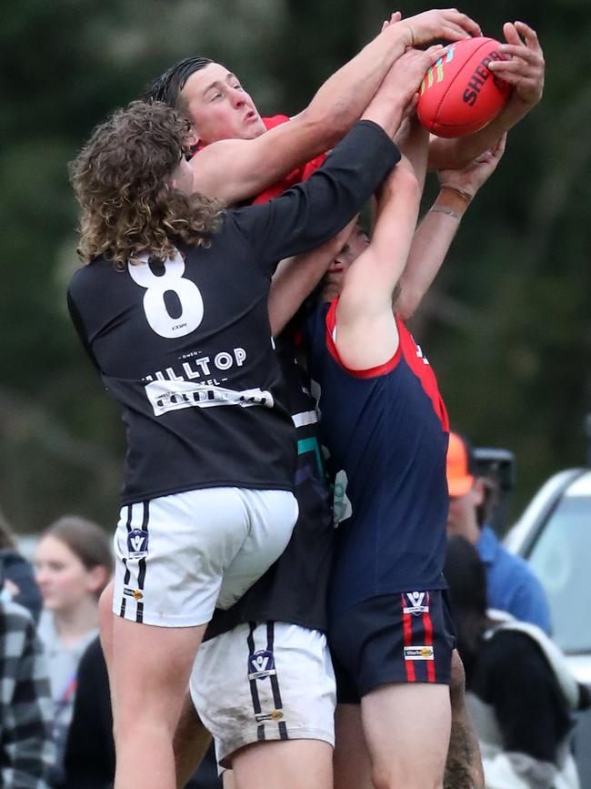 Swifts Creek’s Conor Harvey and Omeo-Benambra’s Aiden Hayward fly over the top.