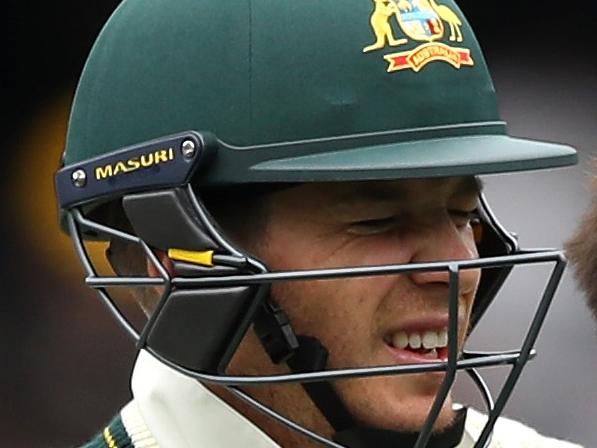 ADELAIDE, AUSTRALIA - DECEMBER 03:  Tim Paine of Australia receives medical attention for an injured finger during day two of the Second Test match during the 2017/18 Ashes Series between Australia and England at Adelaide Oval on December 3, 2017 in Adelaide, Australia.  (Photo by Cameron Spencer/Getty Images)