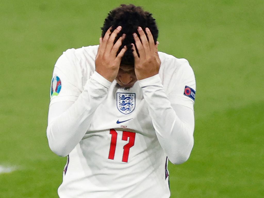 England's forward Jadon Sancho reacts after missing his penalty.