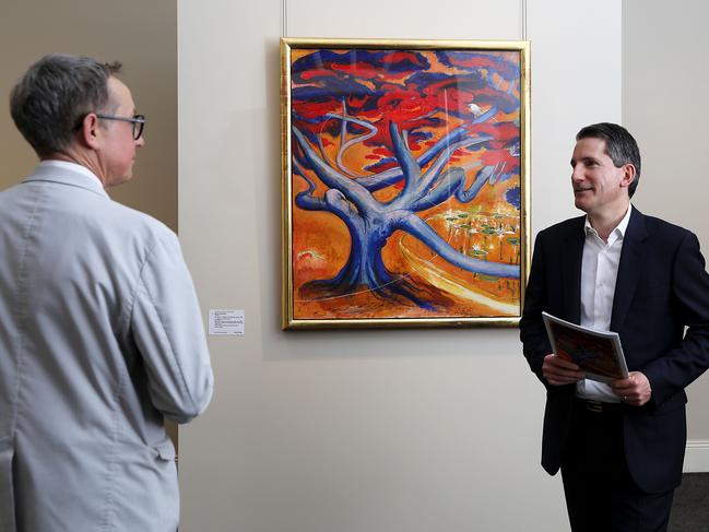 Smith & Singer (L-R) senior art specialist Brett Ballard and chairman Geoffrey Smith with a painting by Brett Whiteley, The Arrival - A Glimpse in the Botanical Garden.The painting is being offered in a single-work, private auction on Tuesday evening and is expected to fetch between $900,000 - $1.2M. Jane Dempster/The Australian.