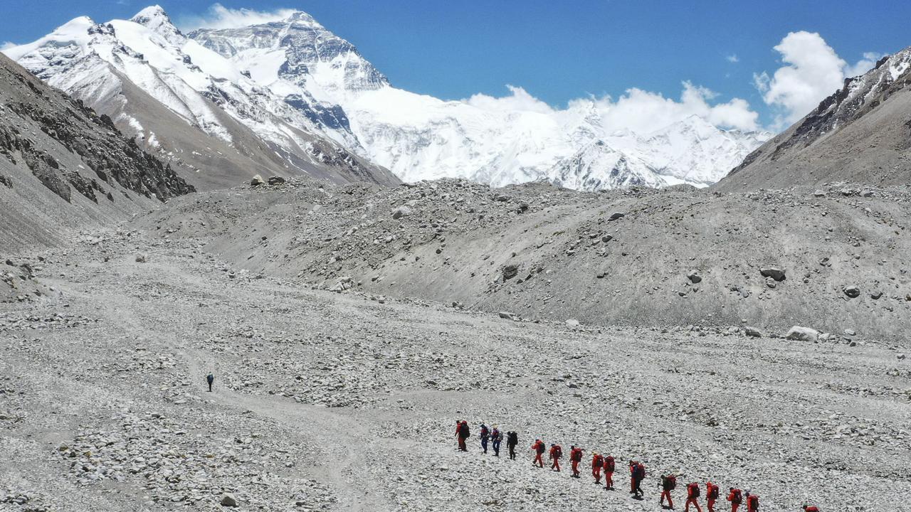 Chinese surveyors hike towards a higher spot from the base camp on Mount Qomolangma (Mount Everest) at an altitude of 5200m on May 16. Picture: AP
