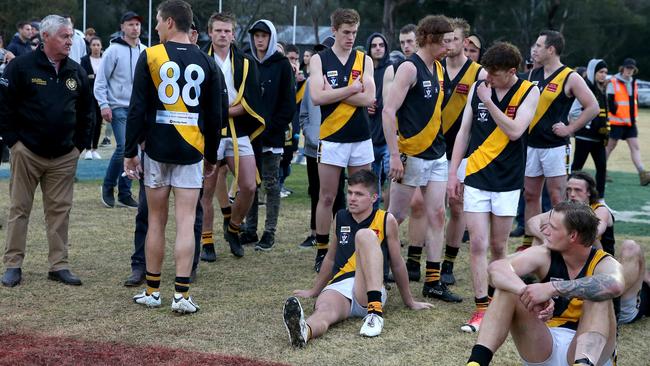 Dejected Woori Yallock players after the grand final defeat. Picture: Mark Dadswell