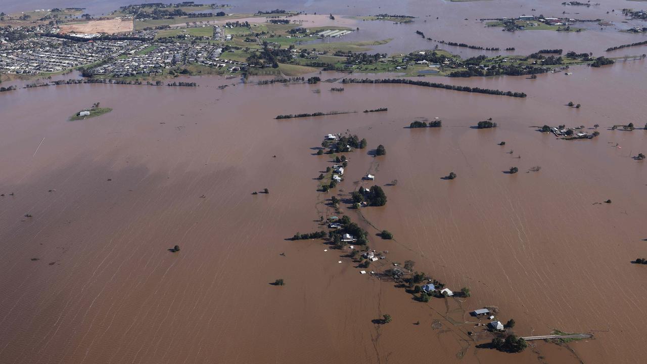 Many homes in the Hunter Region have been swallowed by the swollen river. Picture: David Swift