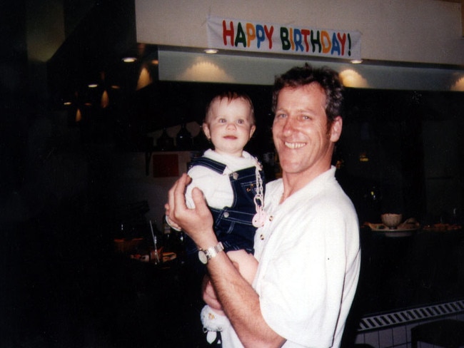 ‘I was so in love with them’ … Craig Folbigg with fourth baby Laura, at her first birthday party in 1998. She died six months later.