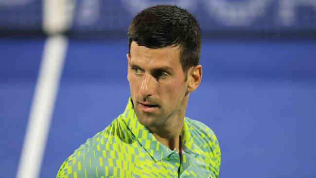 Serbia's Novak Djokovic reacts during his match with Russia's Daniil Medvedev (not pictured) at the ATP Dubai Duty Free Tennis Championship semi-final match in Dubai, on March 3, 2023. (Photo by Karim SAHIB / AFP)