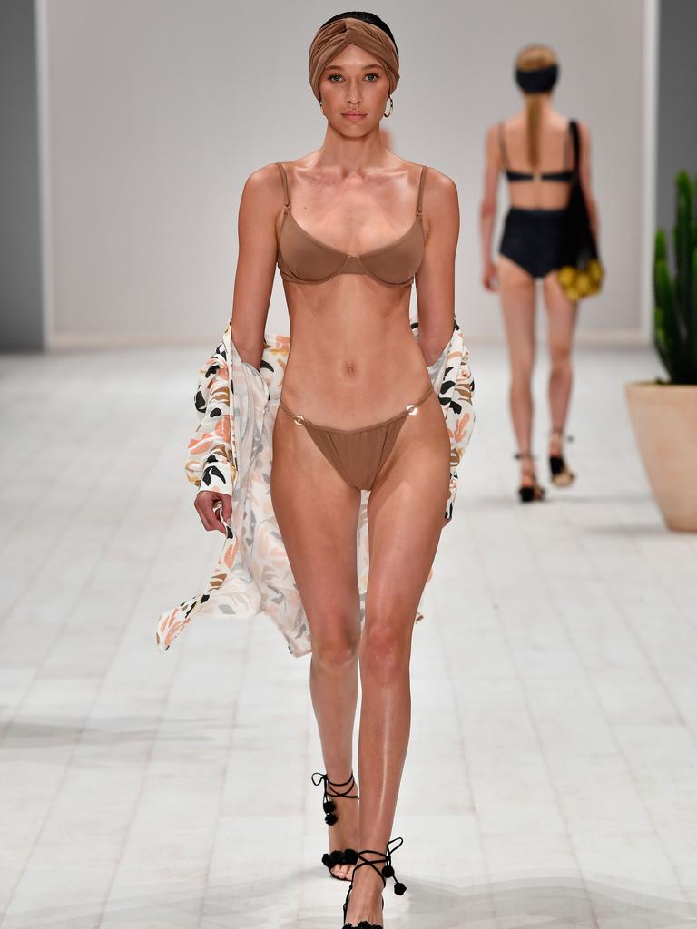 A model walks the runway in a design by Fella during the Swim show at Mercedes-Benz Fashion Week Resort 19 Collections at Carriageworks on May 14, 2018 in Sydney, Australia. (Photo by Stefan Gosatti/Getty Images)