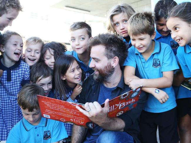 Musician Josh Pyke poses for a photo with the students from Bourke Street Public School at the launch of the Great Book Swap 2018. Picture: Danny Aarons