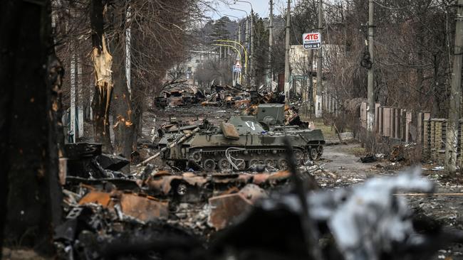 Destroyed Russian armoured vehicles line the street in the city of Bucha, west of Kyiv, in March. Picture: AFP