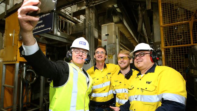 Malcolm Turnbull takes a selfie with workers on a tour at the Visy Plant in Tumut, NSW. (Pic: Kym Smith)