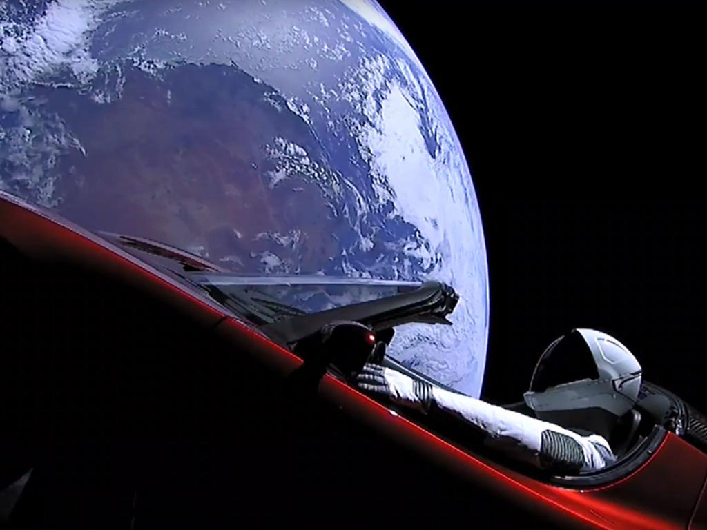 TOPSHOT - This still image taken from a SpaceX livestream video shows "Starman" sitting in SpaceX CEO Elon Musk's cherry red Tesla roadster after the Falcon Heavy rocket delivered it into orbit around the Earth on February 6, 2018. Screams and cheers erupted at Cape Canaveral, Florida as the massive rocket fired its 27 engines and rumbled into the blue sky over the same NASA launchpad that served as a base for the US missions to Moon four decades ago. / AFP PHOTO / SPACEX / HO / RESTRICTED TO EDITORIAL USE - MANDATORY CREDIT "AFP PHOTO / SPACEX" - NO MARKETING NO ADVERTISING CAMPAIGNS - DISTRIBUTED AS A SERVICE TO CLIENTS