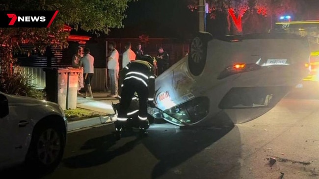 SA Police allege the 25-year-old off-duty driver from the western suburbs crashed into three parked cars and then managed to pull himself out of the wreckage uninjured. Picture: 7NEWS