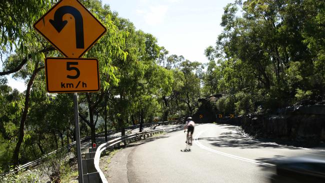 A cyclist on the road near Galston Gorge.