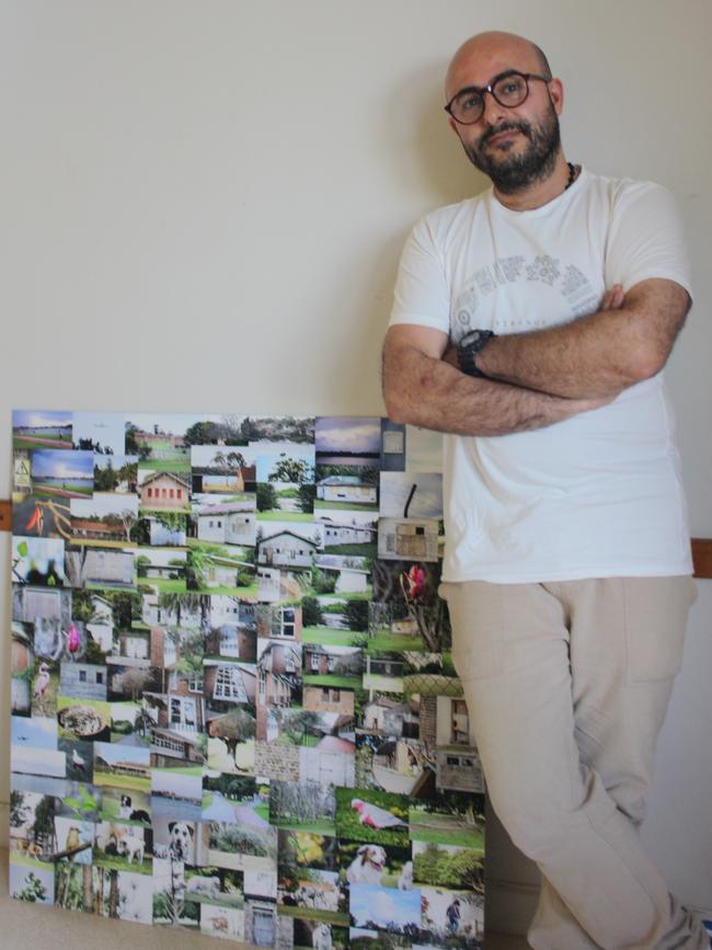 Damon in front of a piece of photography he put together of the faces and places of Callan Park. Picture: Alexi Demetriadi