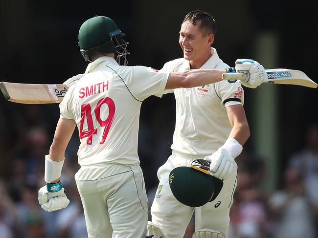 Australia's Marnus Labuschagne celebrates his century with Australia's Steve Smith during Day 1 of the Sydney Test match between Australia and New Zealand at the SCG. Picture: Brett Costello