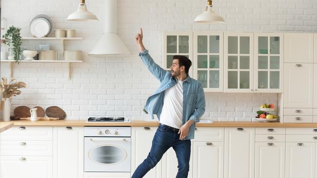 Carefree young man having fun dancing