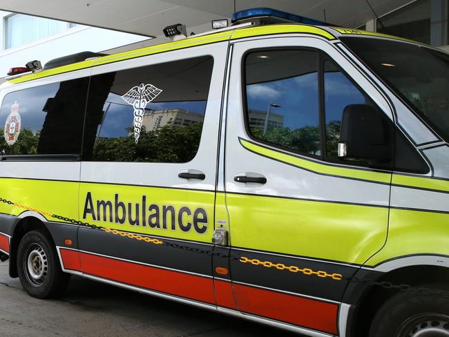 Queensland Ambulance Service medics outside the Pacific Hotel on Spence Street. March 17 2021. Picture: Peter Carruthers