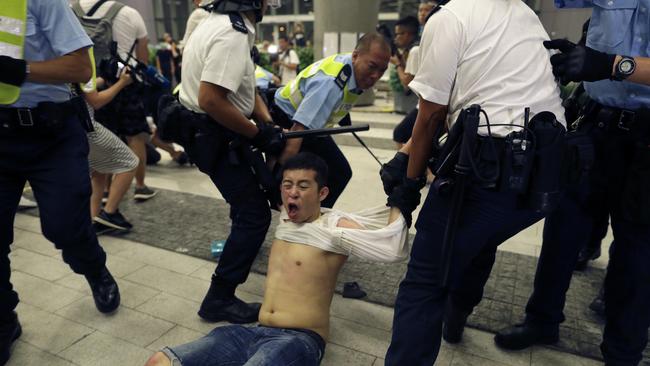 Hong Kong police arrest a protester outside the Legislative Council yesterday. Picture: AP