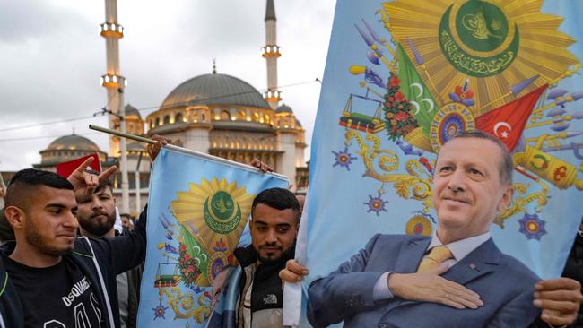 Supporters of Turkish President Recep Tayyip Erdogan celebrate on the day of the Presidential run-off vote in Istanbul. Picture: AFP.