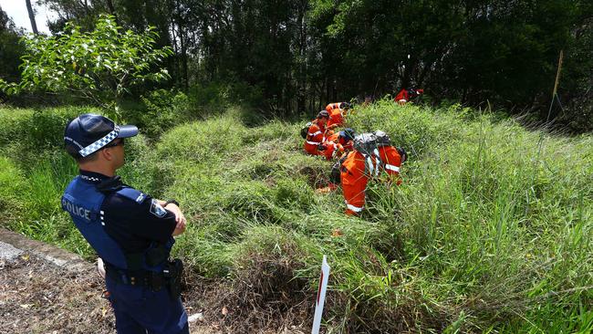 Police and SES combed a Gold Coast creek and roadside in December to search for an alleged murder weapon. Picture: David Clark