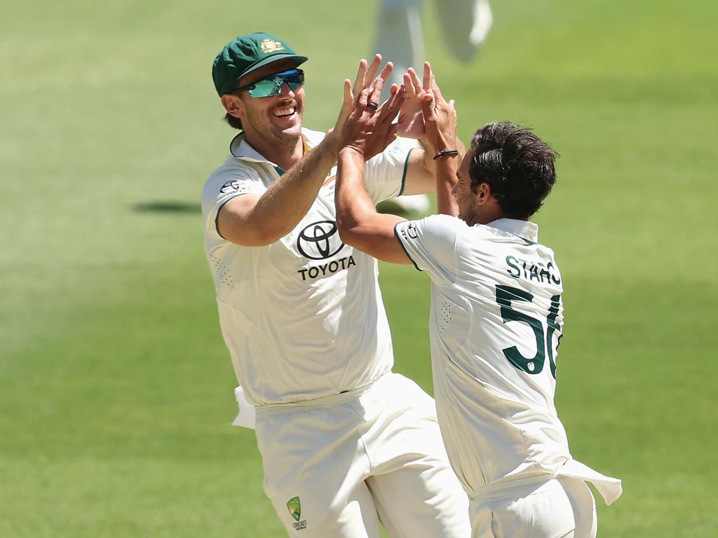 Mitchell Starc of Australia celebrates with Mitchell Marsh of Australia after dismissing Abdullah Shafique.