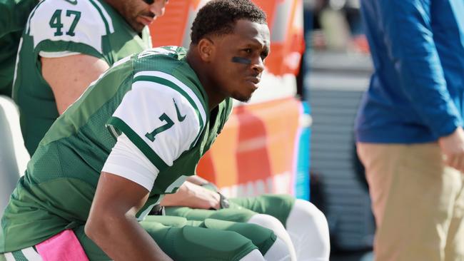 Quarterback Geno Smith #7 of the New York Jets sits on the sidelines after being taken out of the game due to an injury.