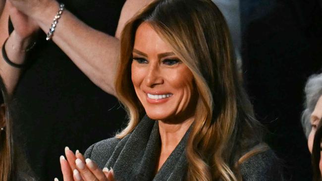 US First Lady Melania Trump (2nd R) stands as she is recognized by US President Donald Trump during Trump's address to a joint session of Congress in the House Chamber of the US Capitol in Washington, DC, on March 4, 2025. (Photo by Jim WATSON / AFP)