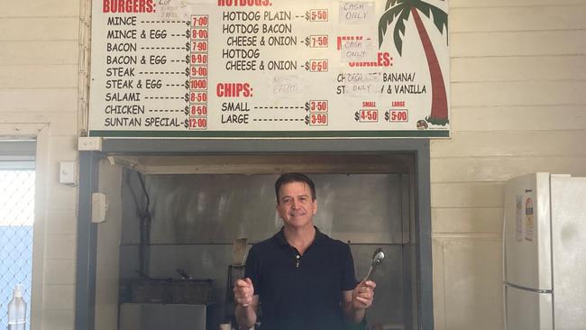 With help from his wife and daughter, Steve Wilson does all the cooking at has beloved Bowen burger joint, Suntan Snackbar. Picture: Supplied.