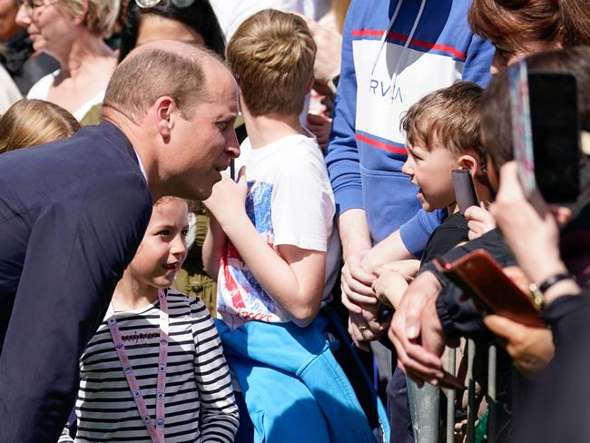 Prince William speaks to a young boy during a walkabout meeting members of the public on the Long Walk near Windsor Castle. Picture: Getty Images