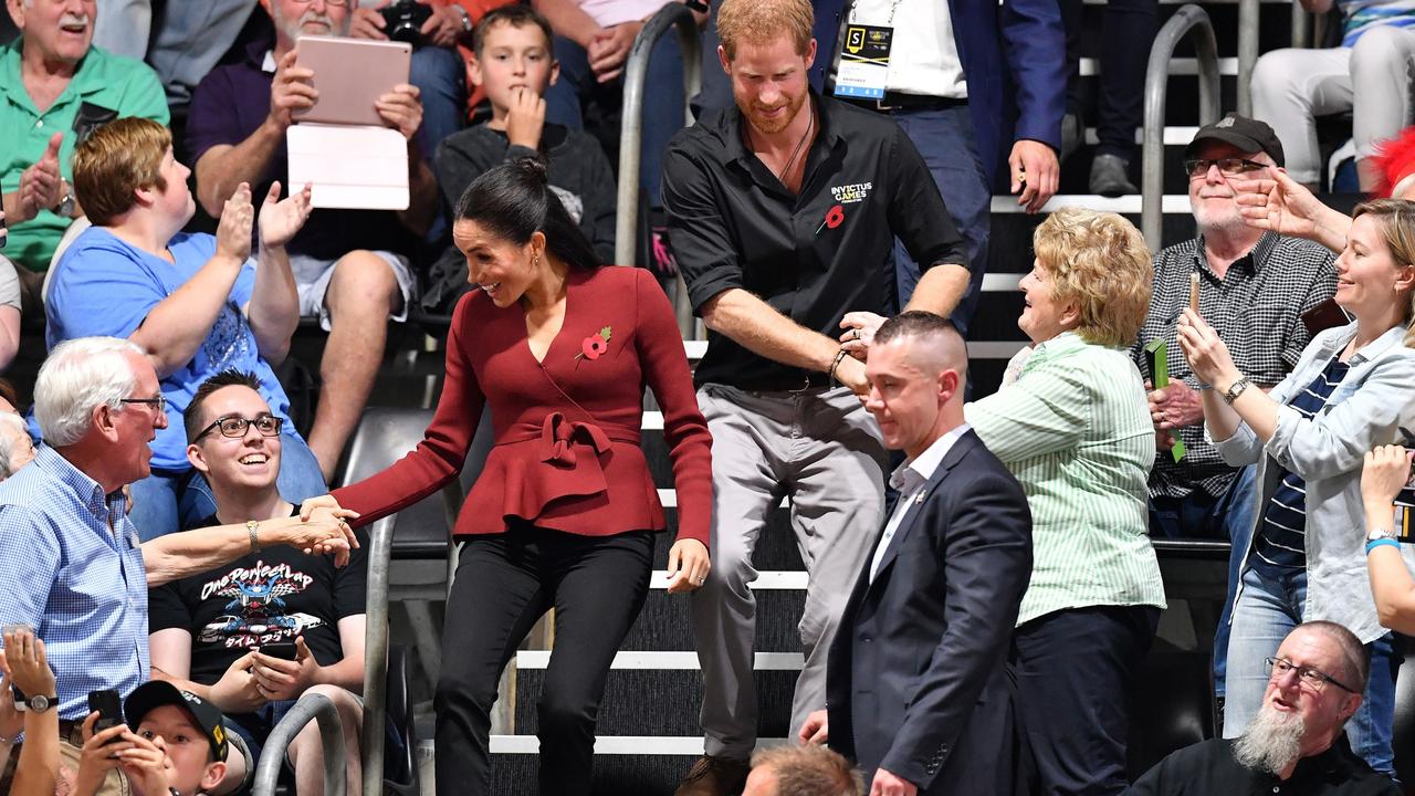 Prince Harry and Meghan, the Duchess of Sussex arrive at the wheelchair basketball final at the Invictus Games in Sydney. Picture: Saeed Khan.