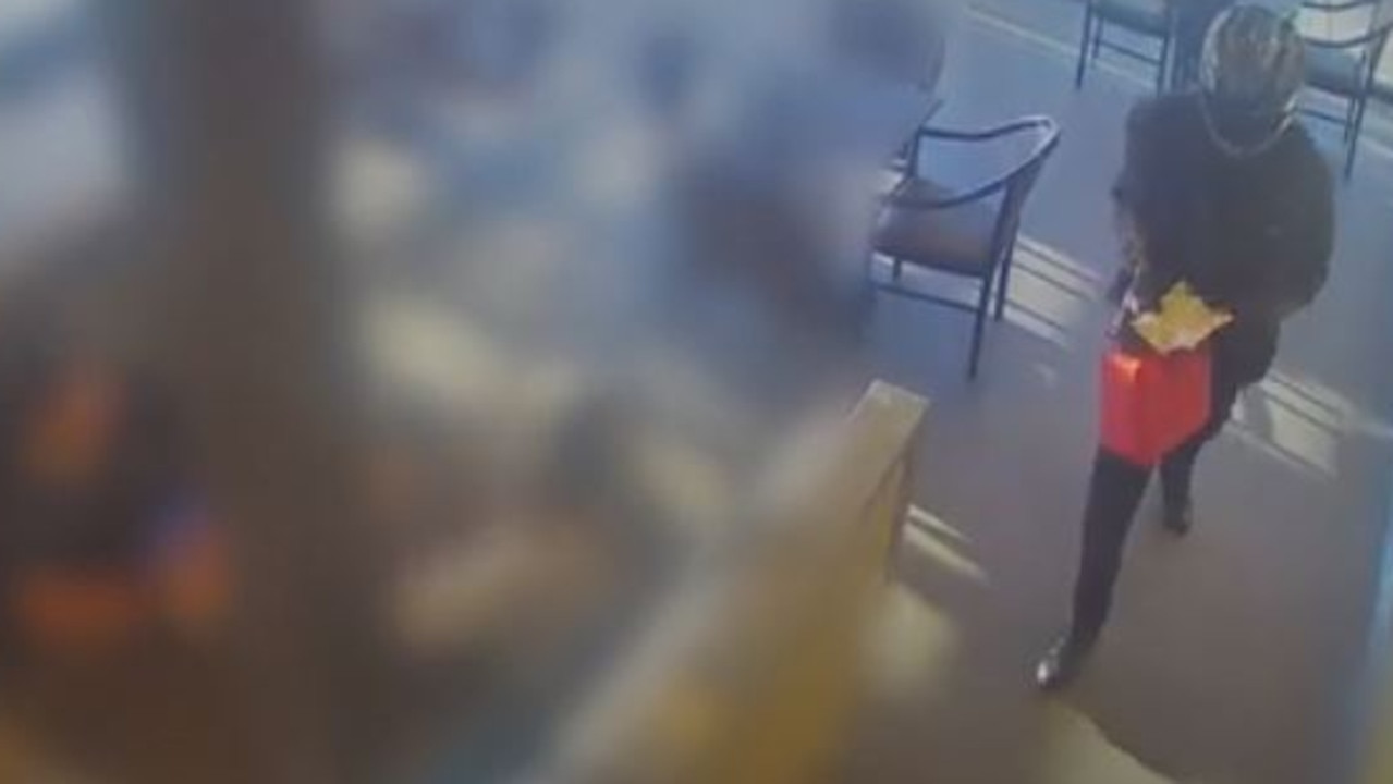 Watch: Gunman in motorcycle helmet robs business on Christmas Eve