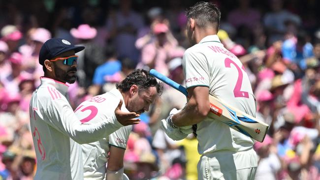 Virat Kohli shakes hands with Australia’s Travis Head and Beau Webster after India lost the fifth and final Test match. Picture: AFP