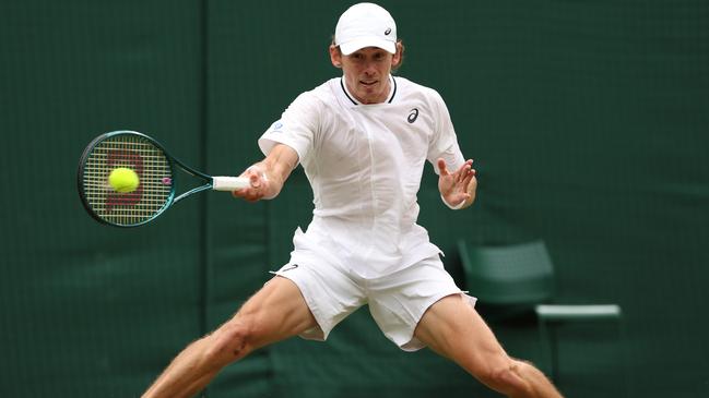 Alex de Minaur of Australia slides to play a forehand against Arthur Fils. Picture: Getty Images