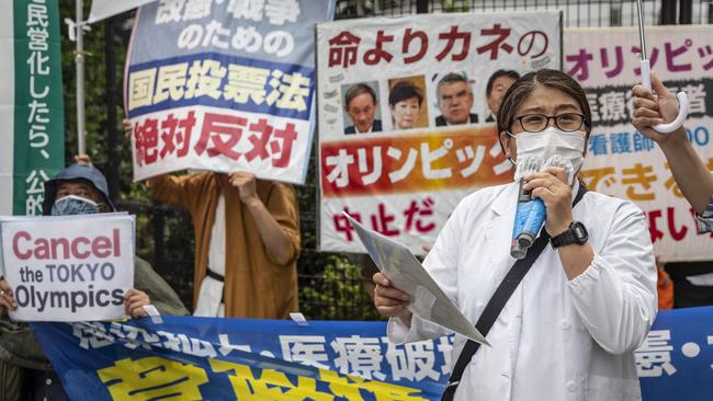 A medical worker speaks during a demonstration against the forthcoming Tokyo Olympic Games on June 6. Picture: Yuichi Yamazaki/Getty Images