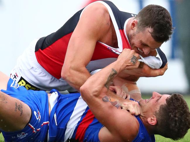 BALLARAT, AUSTRALIA - MARCH 10:  Dylan Roberton of the Saints and Tom Liberatore  of the Bulldogs wrestle during the 2019 JLT Community Series AFL match between the Western Bulldogs and the St Kilda Saints at Mars Stadium on March 10, 2019 in Ballarat, Australia. (Photo by Scott Barbour/Getty Images)