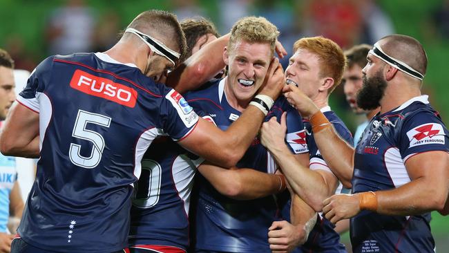 MELBOURNE, AUSTRALIA - MARCH 24:  Reece Hodge of the Rebels (C) celebrates a try with teammates during the round five Super Rugby match between the Rebels and the Waratahs at AAMI Park on March 24, 2017 in Melbourne, Australia.  (Photo by Michael Dodge/Getty Images)