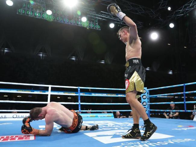 Tim Tszyu stands over Jeff Horn.