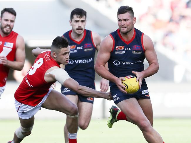 23/09/18 - SANFL - Grand Final - Norwood v North Adelaide at the Adelaide Oval. Mitch Grigg tries to out run Robert Young. Picture SARAH REED