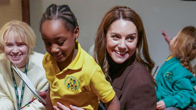 Britain's Catherine, Princess of Wales sits with children from All Souls CE Primary School at the National Portrait Gallery in central London on February 4, 2025, during the launch of a new project from The Royal Foundation Centre for Early Childhood. (Photo by Arthur Edwards / POOL / AFP)