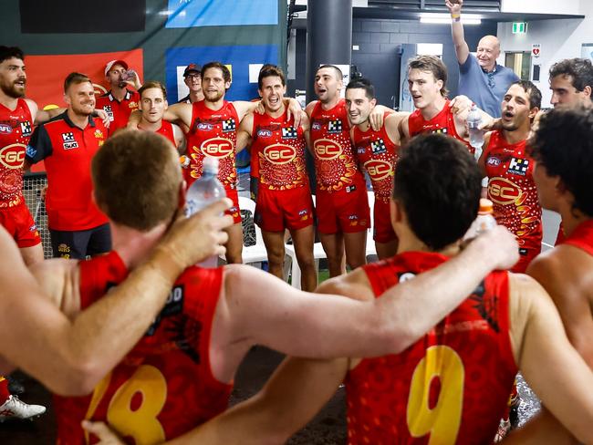 DARWIN, AUSTRALIA - JUNE 03: The Suns sing the team song during the 2023 AFL Round 12 match between the Gold Coast Suns and the Adelaide Crows at TIO Stadium on June 3, 2023 in Darwin, Australia. (Photo by Dylan Burns/AFL Photos via Getty Images)