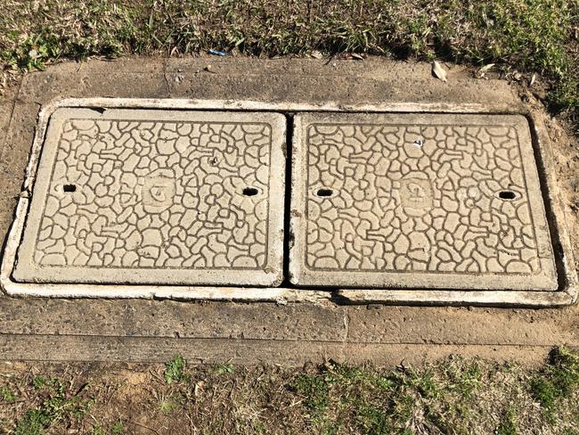 One of the old telecom pits at Marco Ave, Panania, which is being replaced for the NBN rollout. Picture: Lawrence Machado