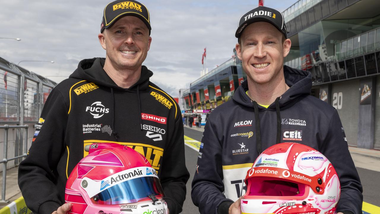 David Reynolds and Mark Winterbottom unveiled the limited-edition pink racing helmets which have been designed and painted by renowned helmet artist Trent Rogers. Picture: Supplied