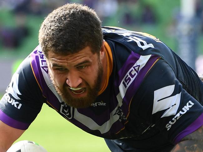 Kenny Bromwich of the Storm (left) is seen as he scores a try during the Round 23 NRL match between the Melbourne Storm and the Gold Coast Titans at AAMI Park in Melbourne, Sunday, August 25, 2019. (AAP Image/Julian Smith) NO ARCHIVING, EDITORIAL USE ONLY