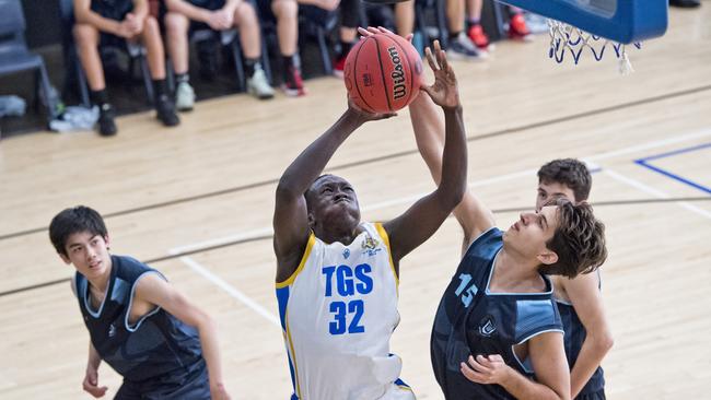 <s1>TO THE RACK: Peter Deng shows his strength in the paint for the Toowoomba Grammar First V.</s1> <ld pattern=" "/> <source>Picture: Nev Madsen</source>