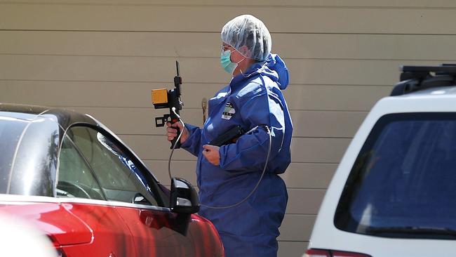 Forensic police are investigating at the home. Picture: Nigel Hallett