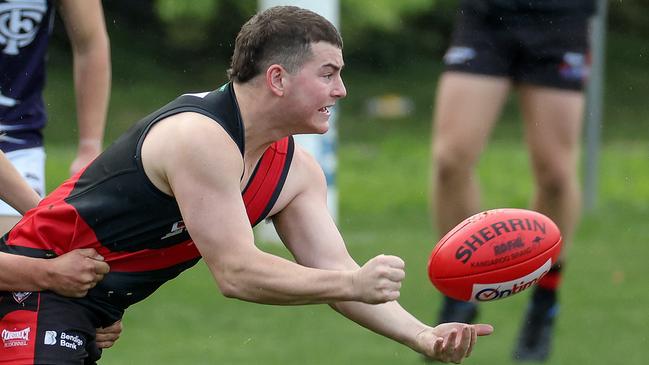 RDFL footy: Riddell v Melton Centrals at Riddell Creek Recreation Reserve. 4th June 2022.  Nathan Croft of Riddell tackled by Jake Sygidus of Melton Centrals.Picture : George Sal