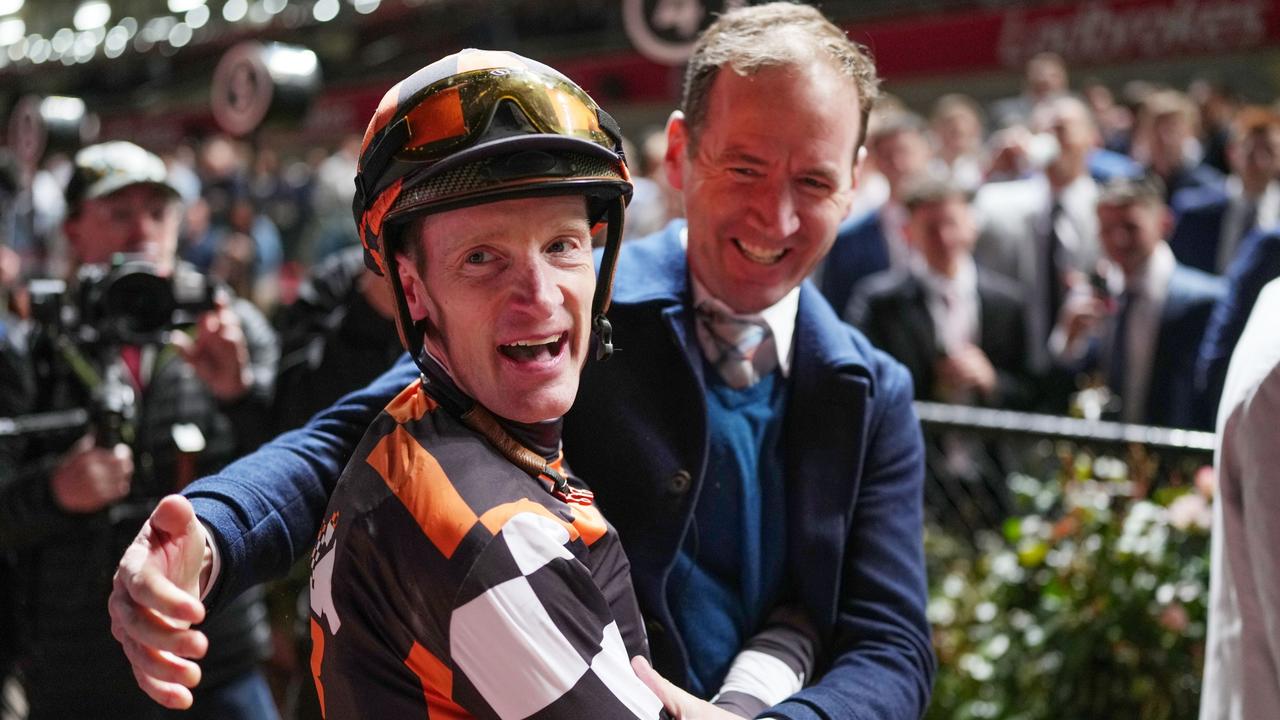 Mark Zahra is embraced by Ciaron Maher after Southport Tycoon won the Manikato Stakes. Picture: Scott Barbour/Racing Photos via Getty Images